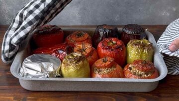 A baking dish with baked stuffed vegetables.