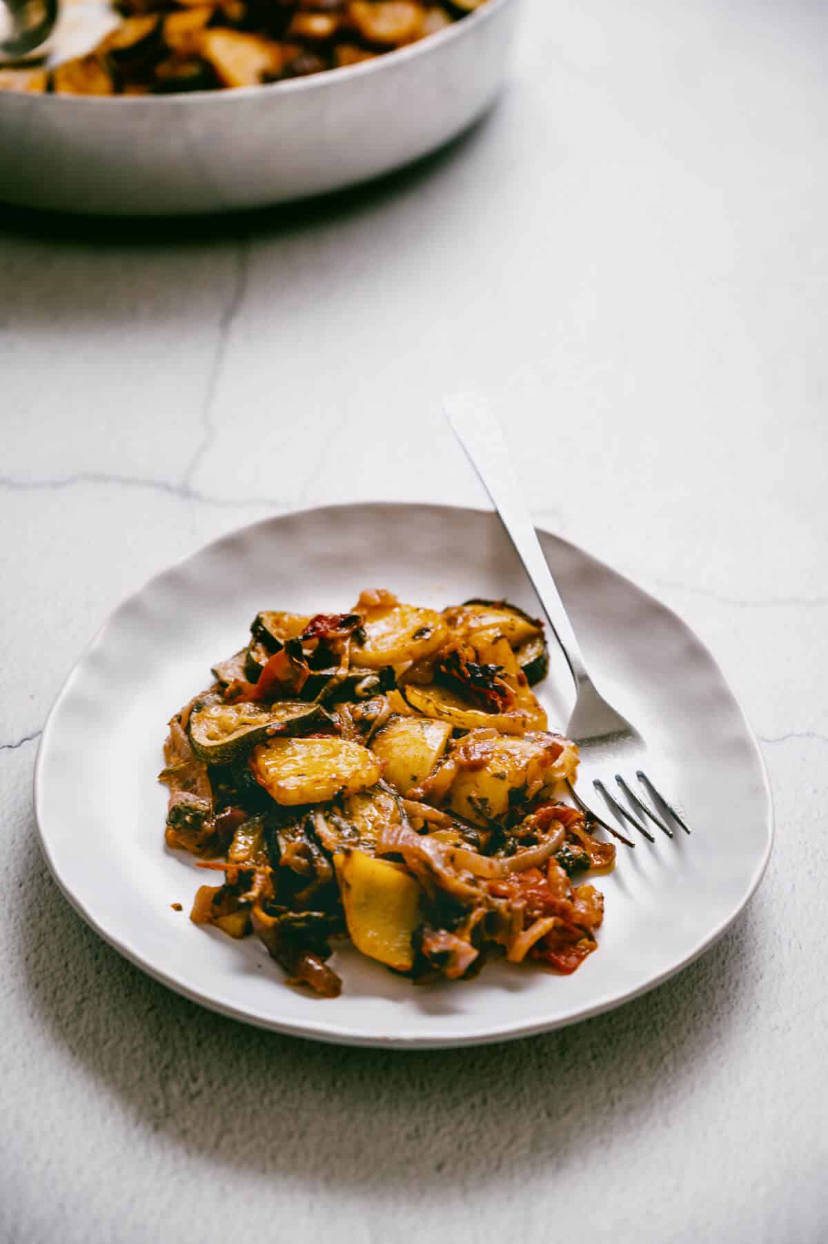Greek baked vegetables on a plate.