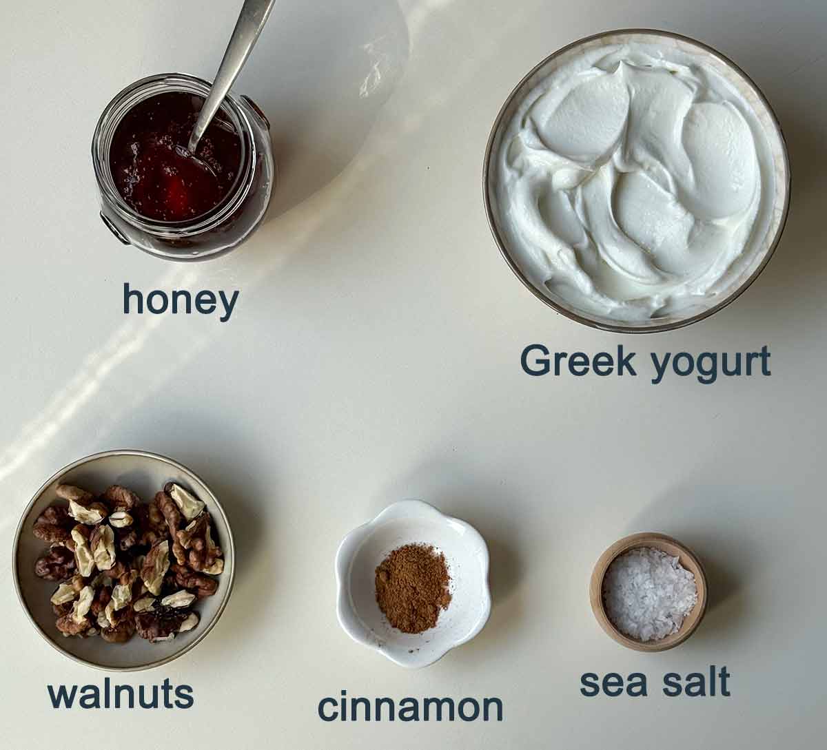 Ingredients for Greek yogurt with honey and walnuts.