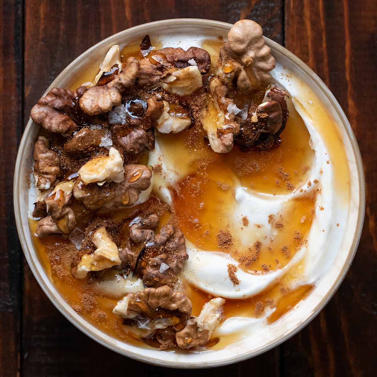 Greek yogurt with honey and walnuts featured.